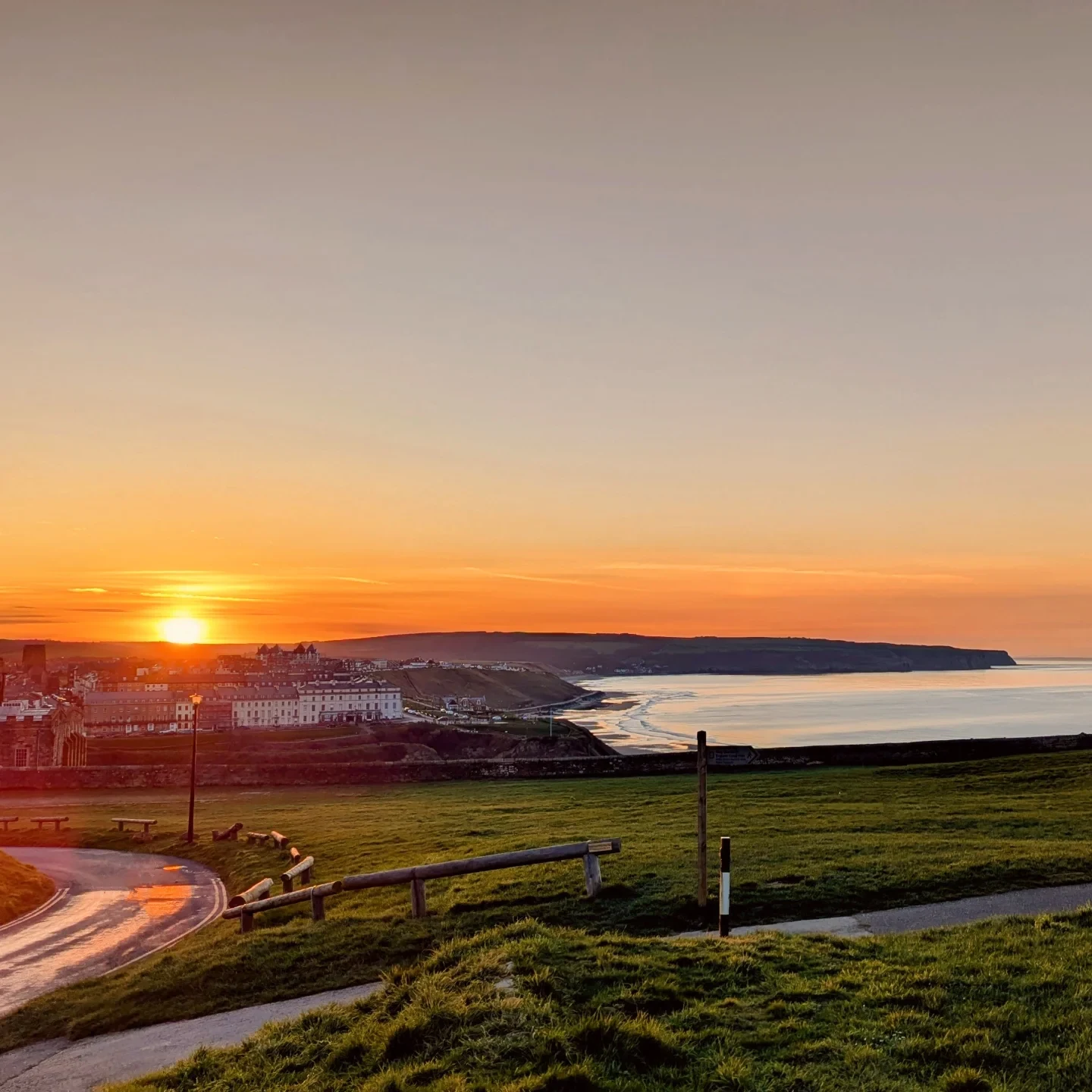 Sunset over Whitby from the headland
